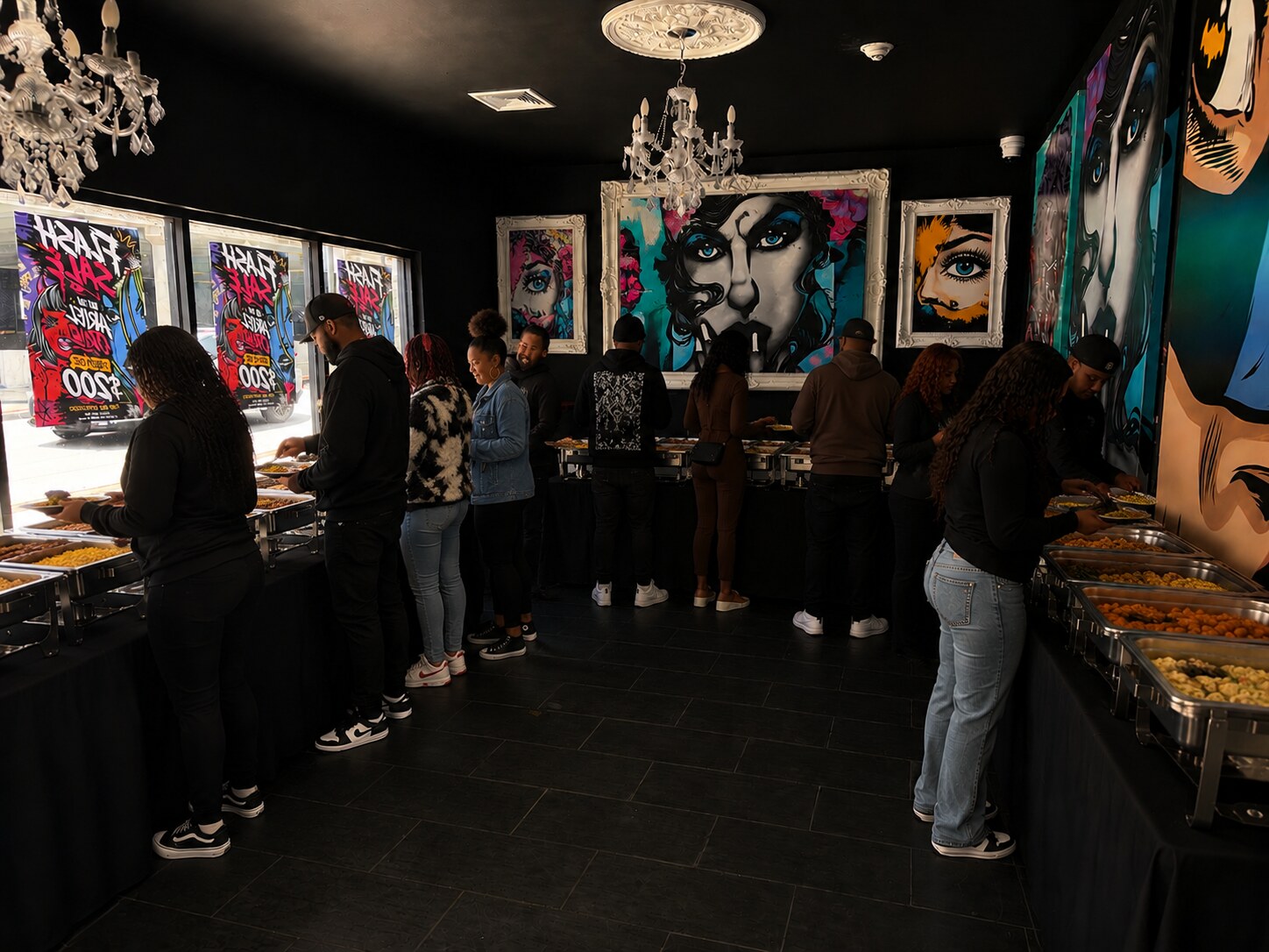 Guests enjoying a buffet surrounded by Ariel Cruz artwork at Acruz